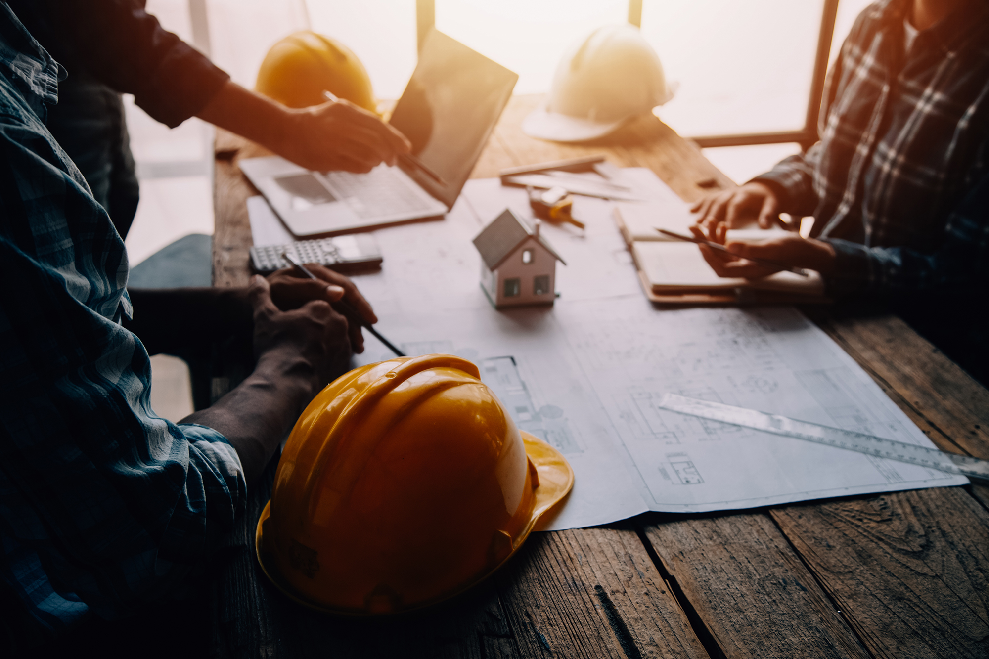 Construction and structure concept of Engineer or architect meet Construction and structure concept of Engineer or architect meeting for project working with partner and engineering tools on model building and blueprint in working site, contract for both companies.